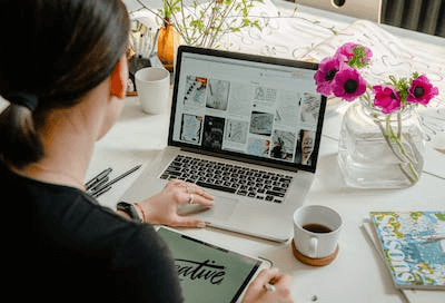 A girl using laptop for writing content.