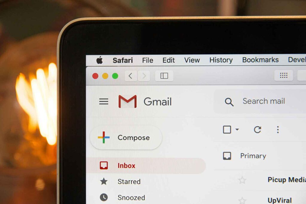  Gmail interface displayed on a laptop, representing how an SEO company manages link-building campaigns through email communication. 